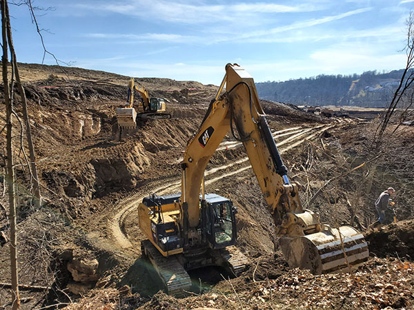 Traditions of America Bore Pit Start Two Excavators